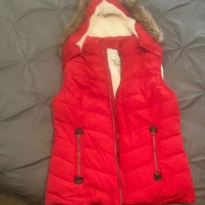 Green tea red vest size medium with furry lining and faux fur trim on collar.